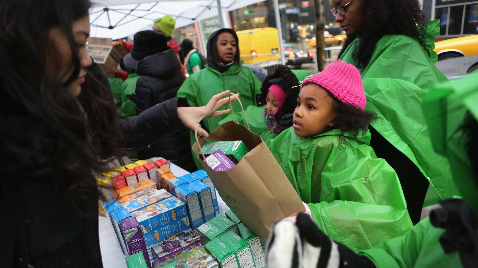 Girl Scouts sell cookies as a winter storm moves in on February 8, 2013 in New York City. Photo: John Moore/Getty Images