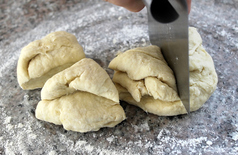 Once the dough has come together, divide it into four pieces that are approximately the same size. Photo: Kate Williams