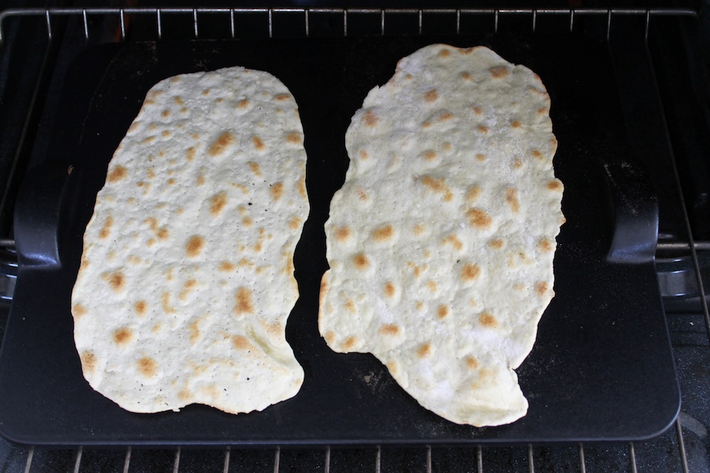 Bake the matzo directly on a pizza stone until golden brown on both sides. Photo: Kate Williams
