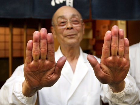 Master sushi chef Jiro Ono shows off his famously soft hands, one of the secrets to his renowned sushi, in front of Ono's sushi restaurant, Sukiyabashi Jiro, in Tokyo, Japan. Located in the drab basement of an old Tokyo office building, Sukiyabashi Jiro is considered the best sushi shop in the world by major food critics. Photo: Everett Kennedy Brown/epa/Corbis