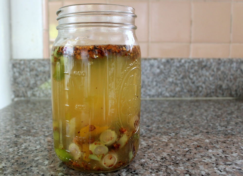 Add water to the mix of fruit and aromatics and let the mixture steep for three days. Photo: Kate Williams