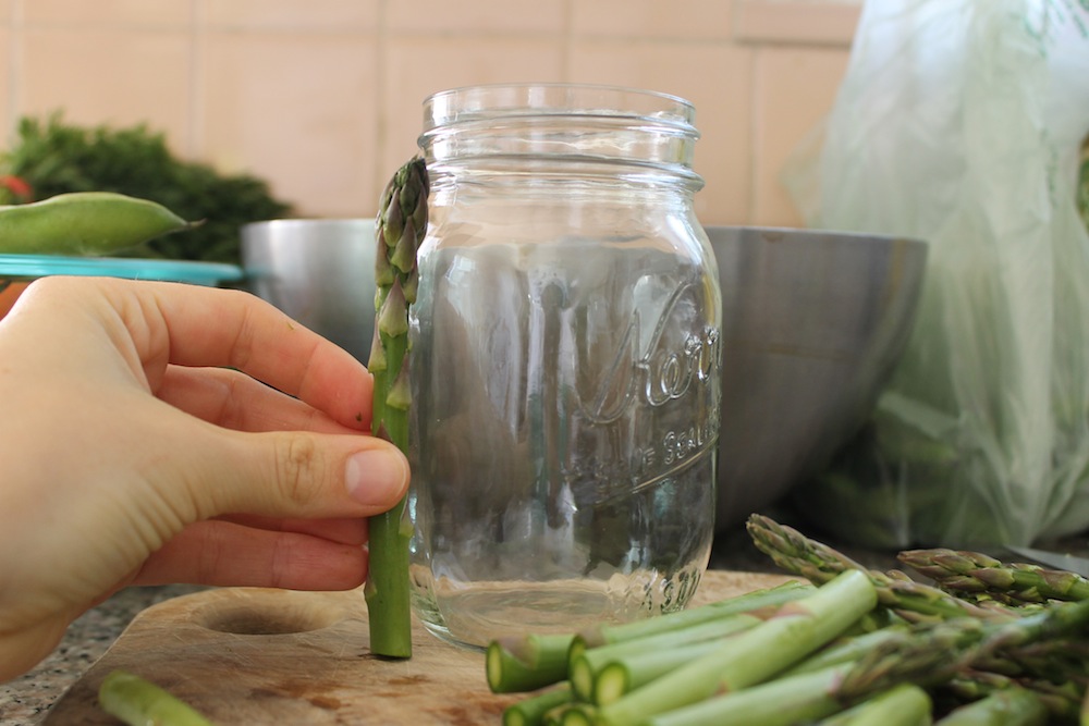 Asparagus should be trimmed of its tough base and cut into pieces that are 3 to 4 inches long. Photo: Kate Williams