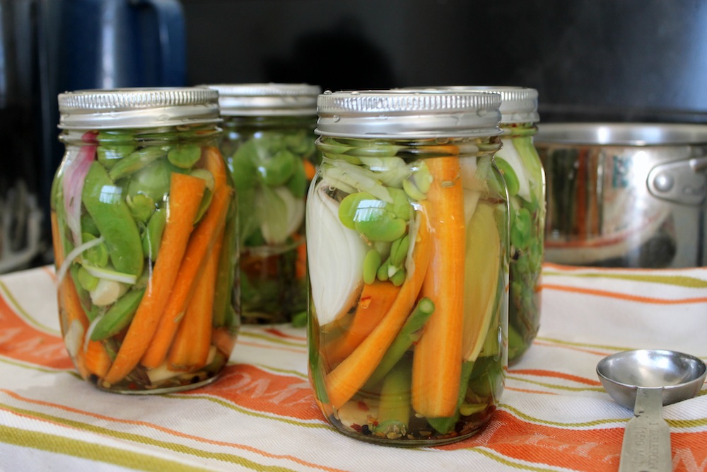 Pack the vegetables into the jars as tightly as possible, as they will shrink upon processing. Photo: Kate Williams