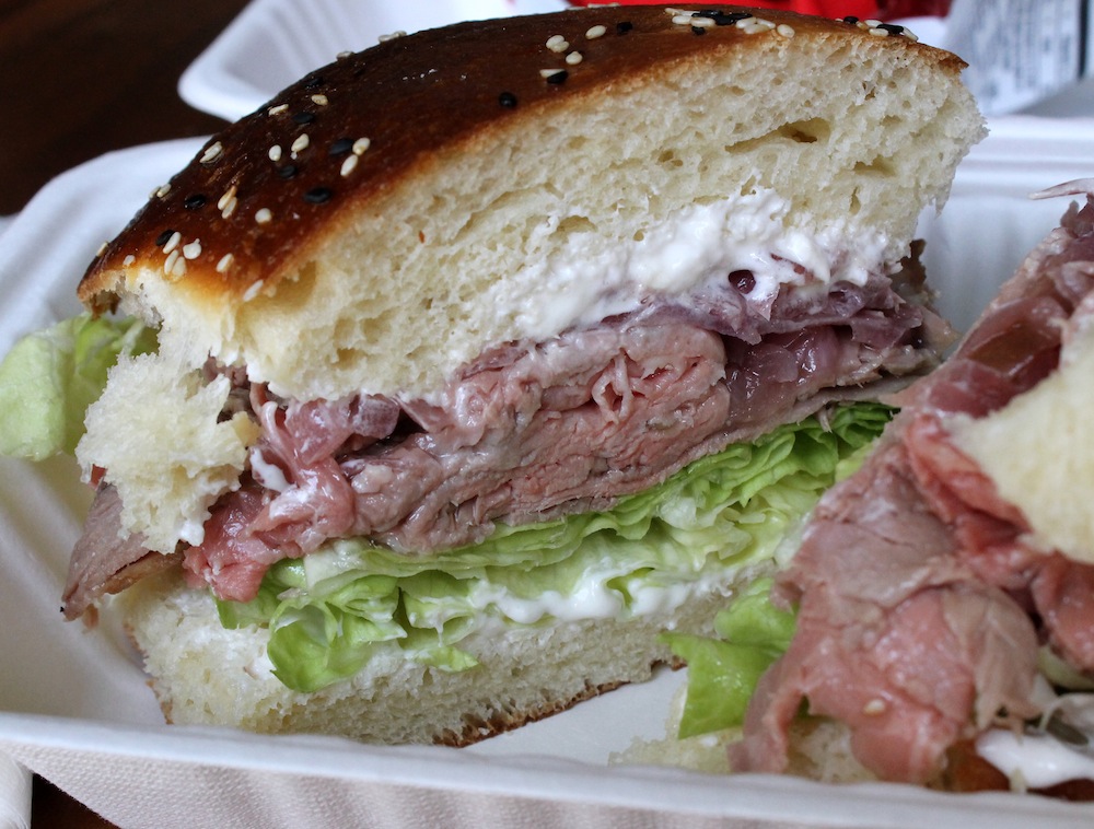 Leary’s roast beef sandwich comes with house made mayonnaise, crisp lettuce, smoked pickled onions, and horseradish cream cheese. Photo: Kate Williams