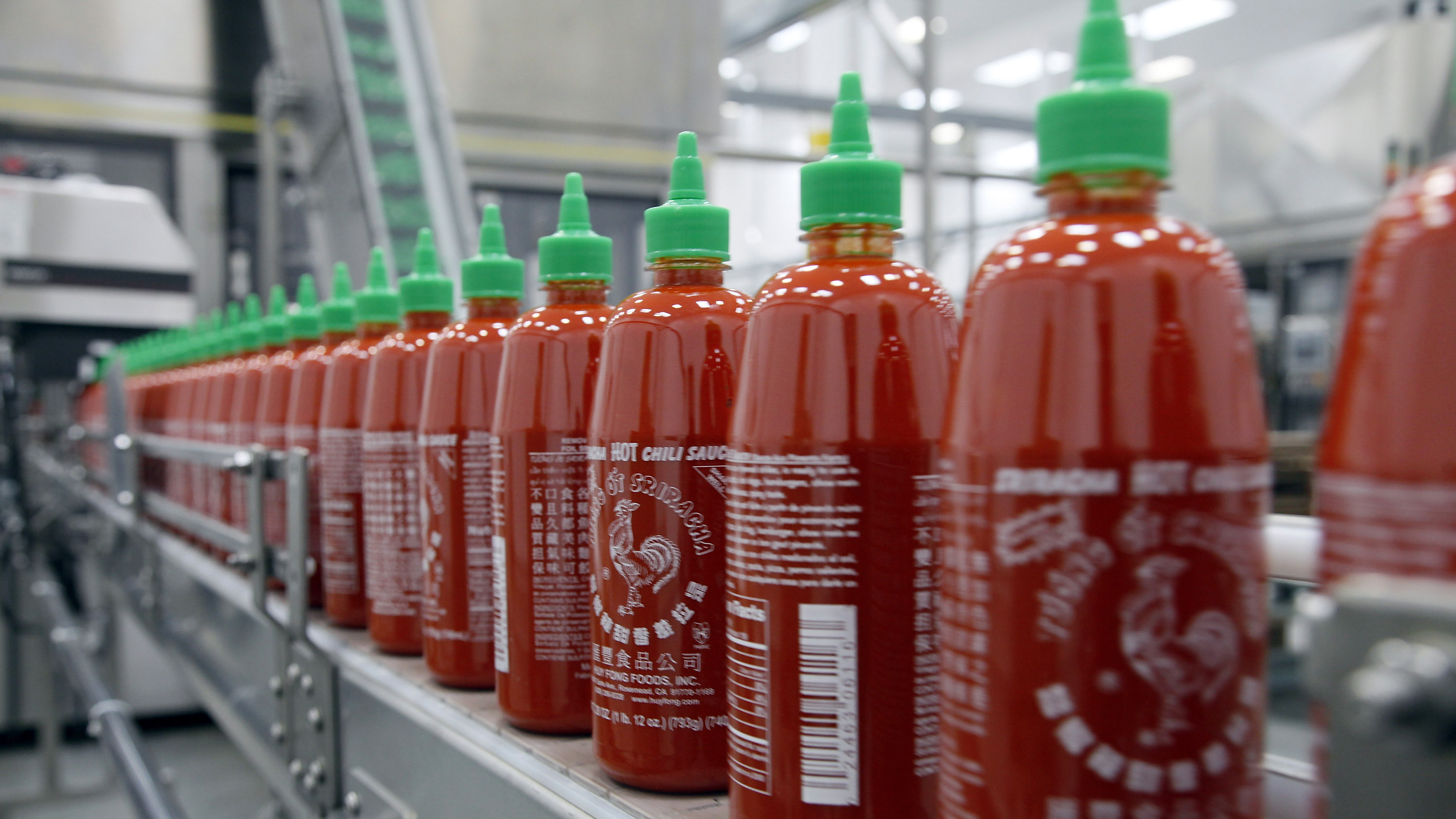 Sriracha chili sauce is produced at the Huy Fong Foods factory in Irwindale, Calif. CEO David Tran has been at odds with the local city council over the smells emitted by the sauce factory. Photo: Nick Ut/AP