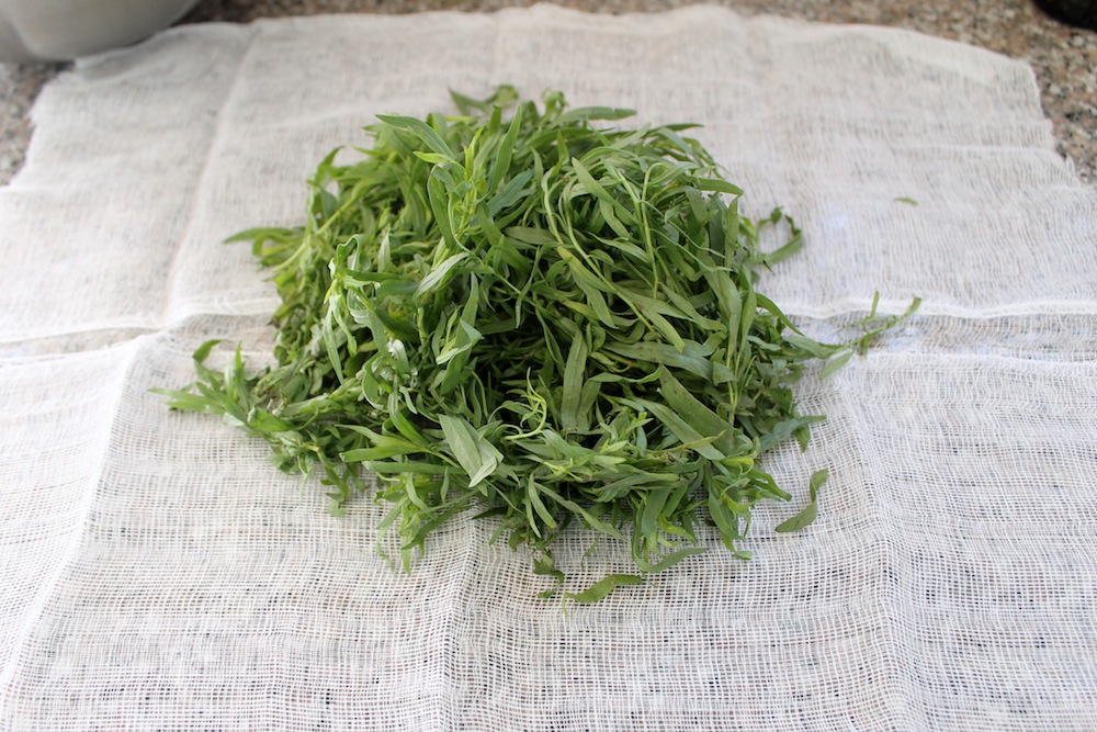 Bundle 2 cups of tarragon leaves and stems in cheesecloth to make it easy to remove from the brine. Photo: Kate Williams