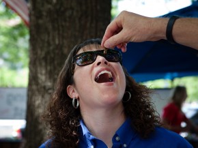 Nancy Troyano, an entomologist with Ehrlich, tries her very first insect. Photo: Maggie Starbard/NPR
