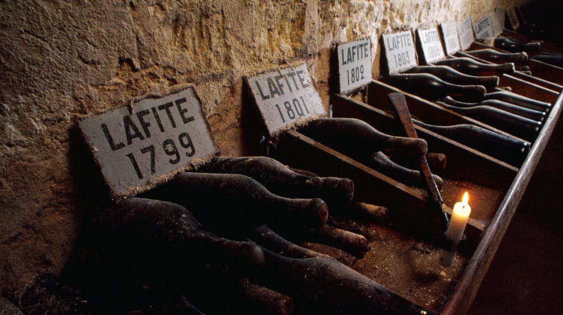 Bottles of vintage wine dating back to the end of the 18th century are carefully labeled and stored in the cellars of Chateau Lafite Rothschild, Bordeaux, France. Photo: Adam Woolfitt/Corbis