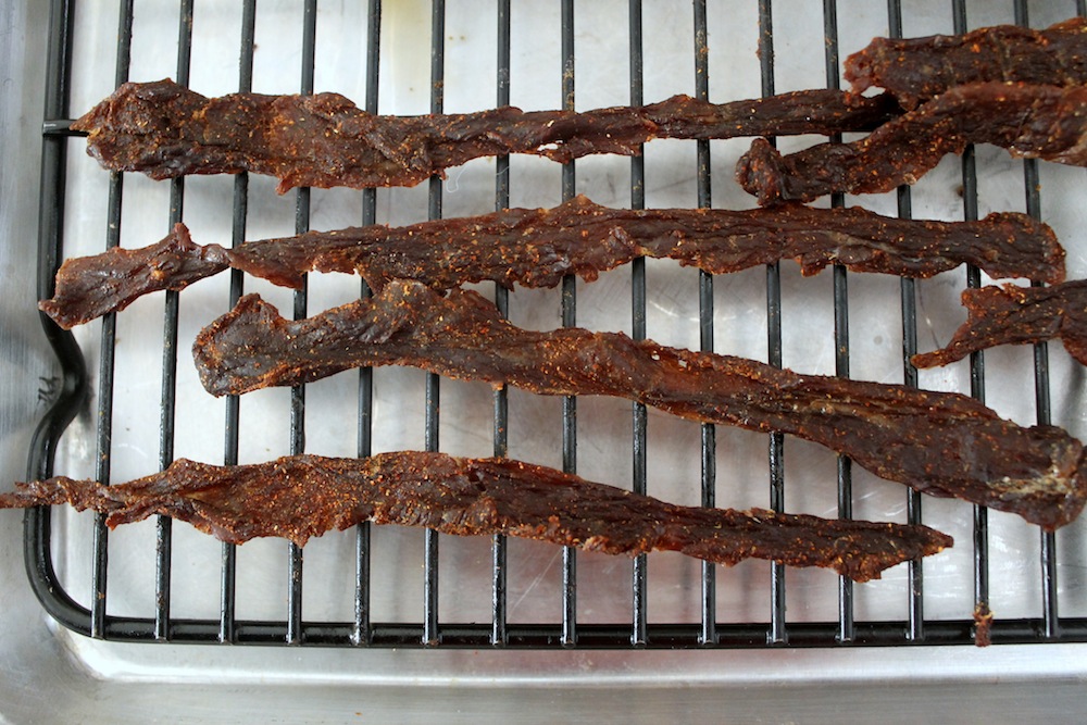 The jerky is finished when it has turned dark brown and is firm and dry in texture. Photo: Kate Williams