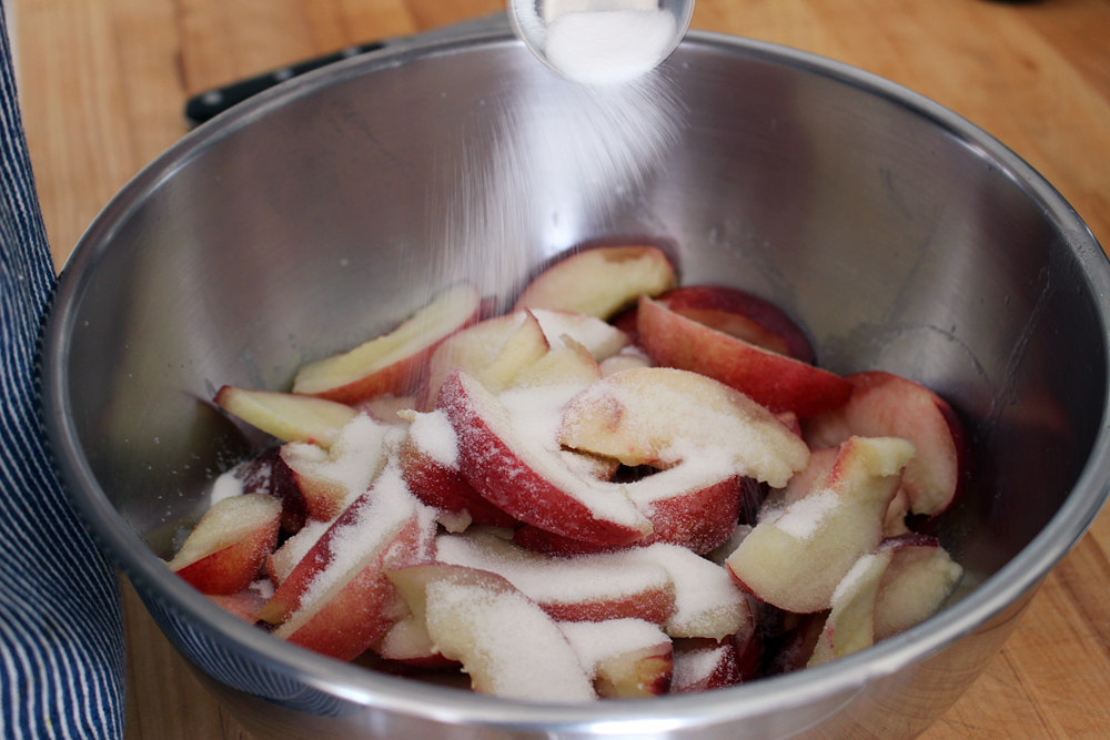 Toss together the nectarine slices with 3 tablespoons sugar. Photo: Wendy Goodfriend
