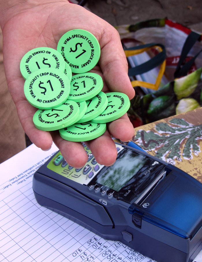 These tokens allow low-income people who receive CalFresh benefits to shop at farmers' markets. Photo: Courtesy of the Ecology Center.