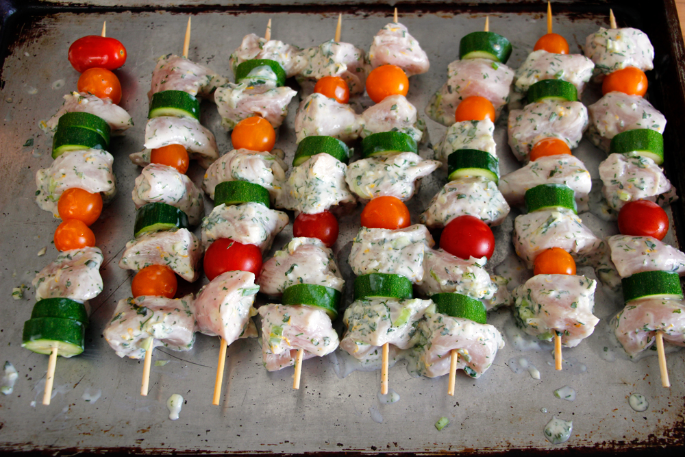 Thread the chicken onto the skewers, alternating with the zucchini and cherry tomatoes. Photo: Wendy Goodfriend