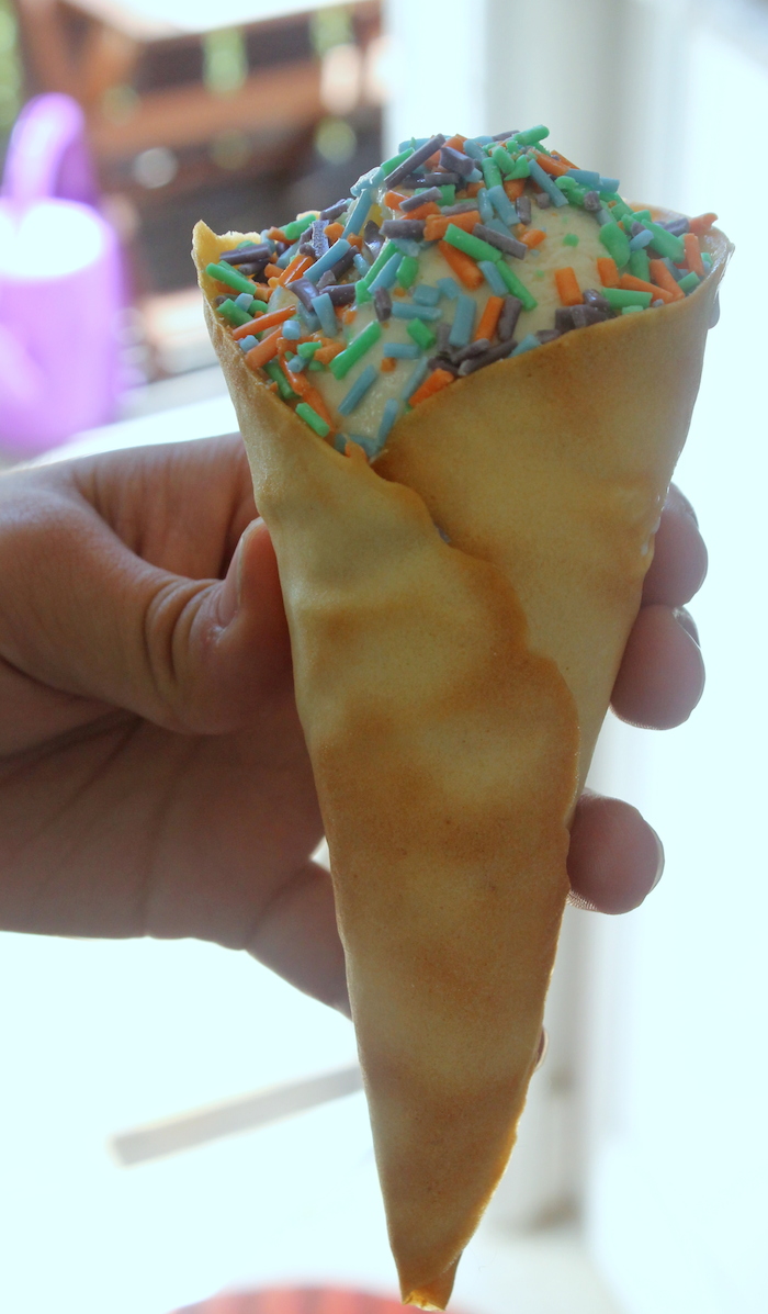 Serve a scoop of ice cream in a cone, topped with a generous scoop of sprinkles. Photo: Kate Williams