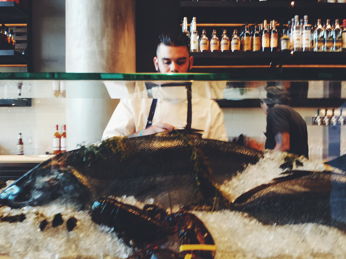 The raw bar provides a centerpiece for the space.