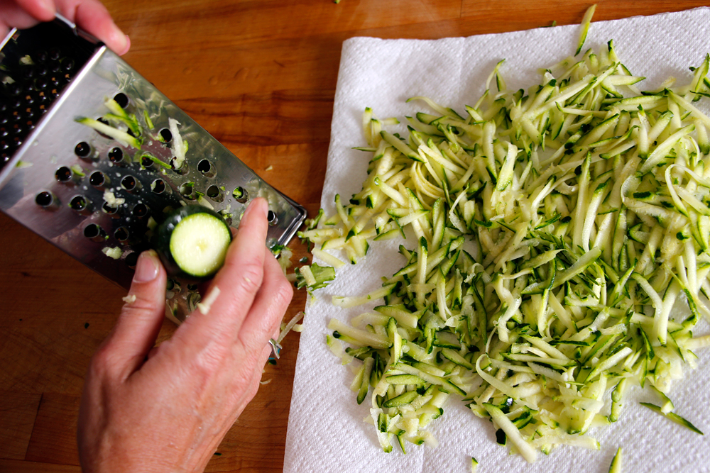 Shred the zucchini on the large holes of a box grater. Photo: Wendy Goodfriend