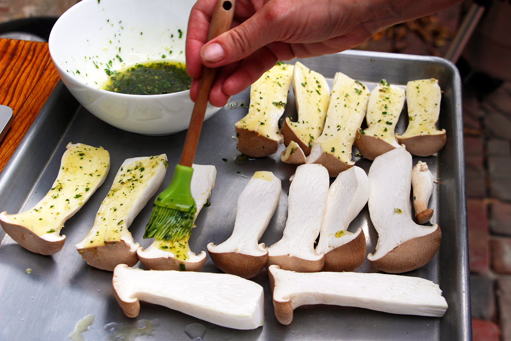 Brush the mushroom slices lightly with the herb-oil mixture. Photo: Wendy Goodfriend