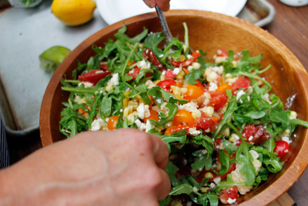 Drizzle with a little olive oil and the lime juice and toss to coat. Add the feta and arugula and gently toss to coat. Photo: Wendy Goodfriend