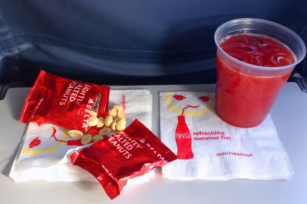 Hungry? These peanuts and drink, served aboard a Delta flight in July, are about all you'll get on domestic flights these days. Photo: Ron Cogswell/Flickr