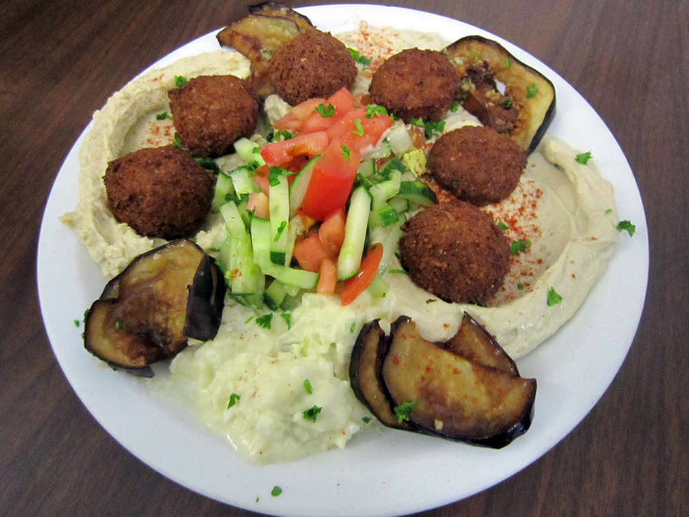 This combination plate with falafel, humus, babaganoush and fried eggplant is popular among vegetarians at Sabra Grill. Photo: Alix Wall