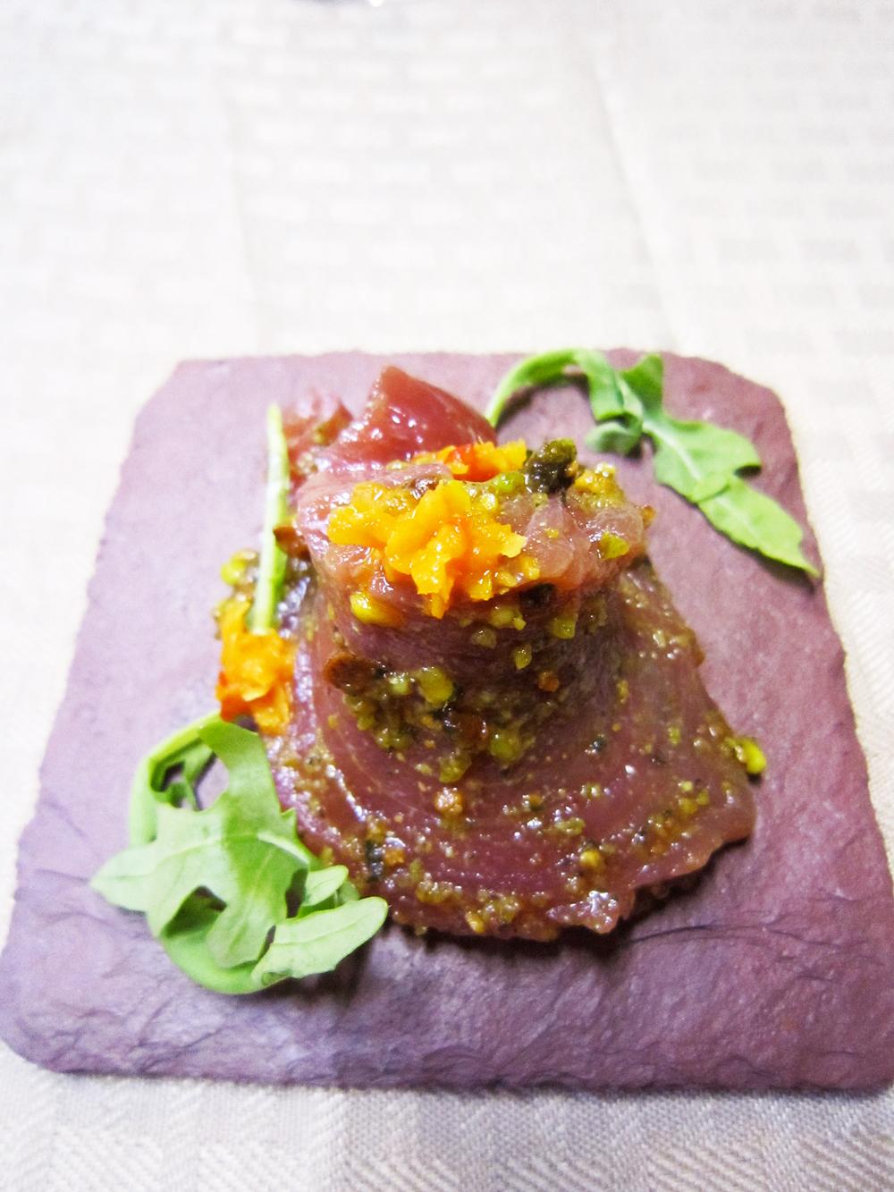 This tuna loin with mint and pistachio pesto and citrus zest fermented with chiles was a course at the kosher pop-up. Photo: Alix Wall