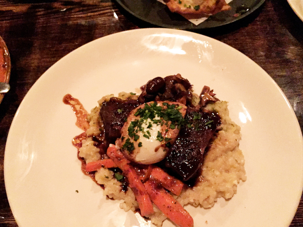  main course of braised short ribs with cauliflower parsnip puree and a smokey poached egg.  Credit: Angela Johnston