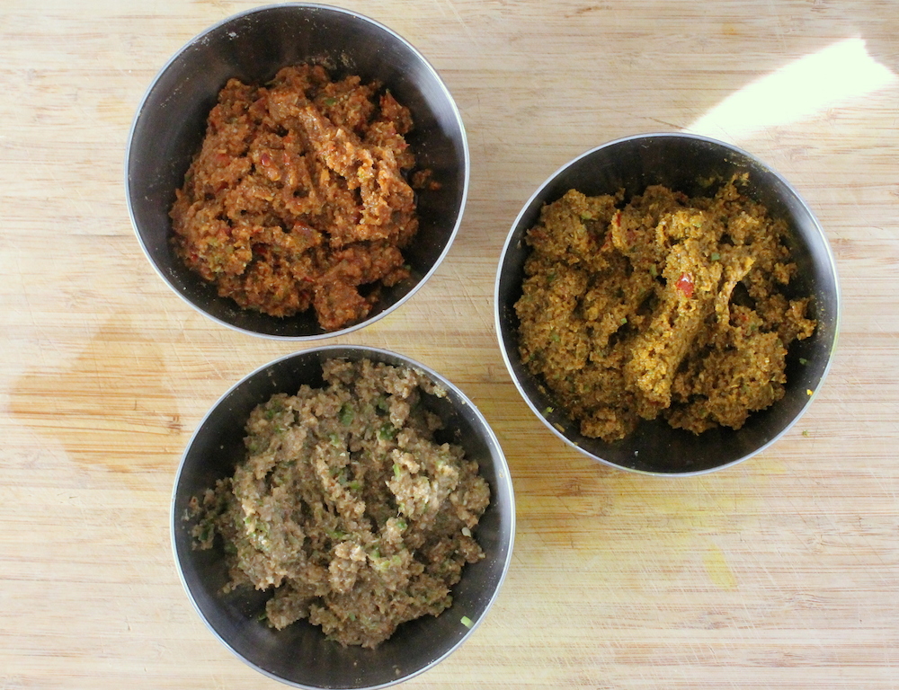 Homemade Thai curry paste in three shades: red, yellow, and green. Photo: Kate Williams