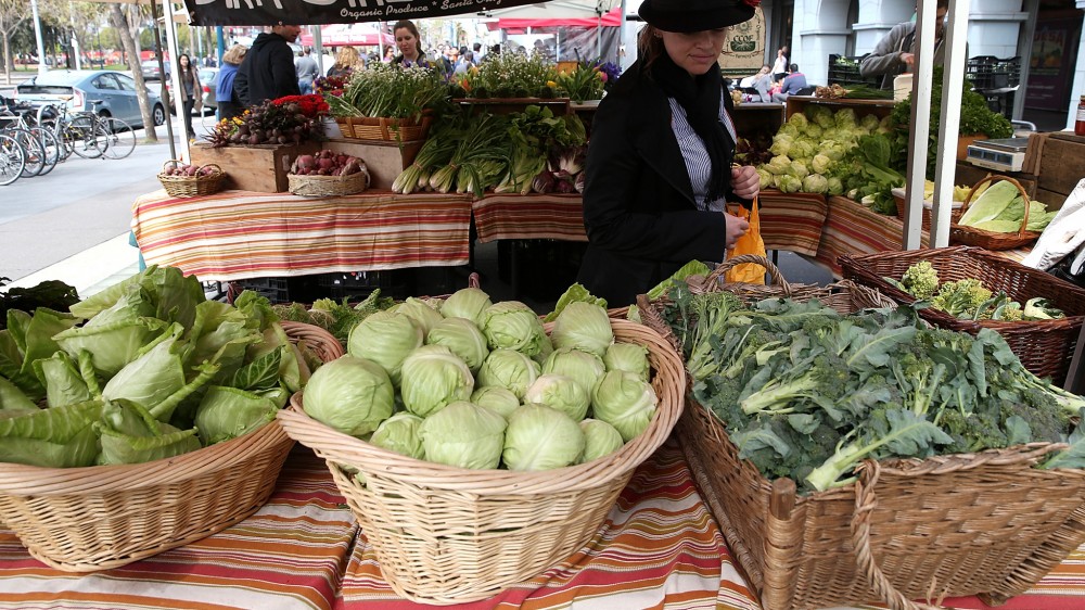 A customer shops for produce at the Ferry Plaza Farmers Market in San Francisco in March. Photo: Justin Sullivan/Getty Images