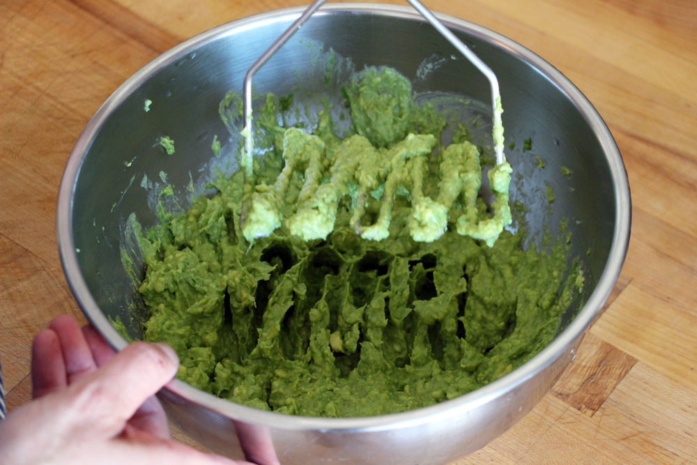 Using a fork or potato masher, mash the avocado until not quite smooth.