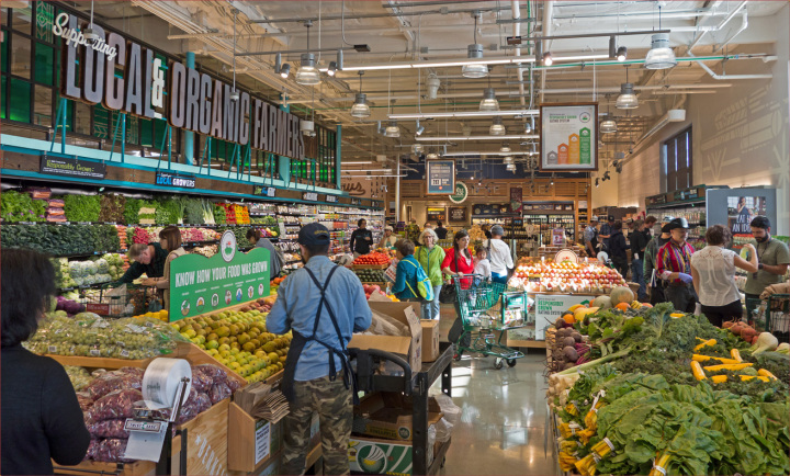 Customers shop for produce in Berkeley’s second Whole Foods store which opened today at Tenth and Gilman streets. Photo: Neil Mishalov