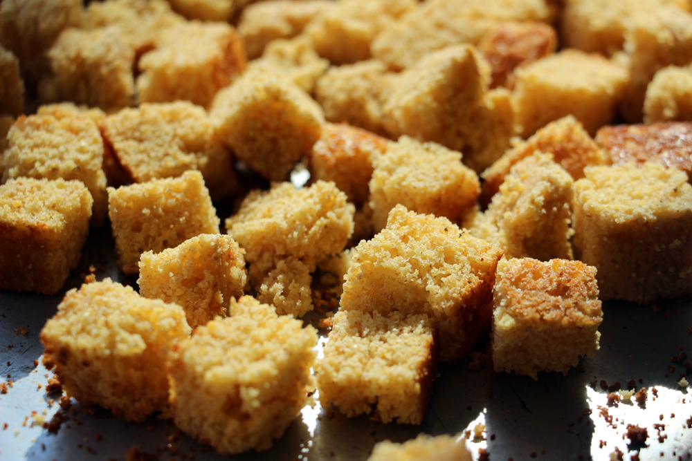 Toast the cornbread cubes in the oven until lightly browned, turning occasionally, about 15 minutes. Photo: Wendy Goodfriend