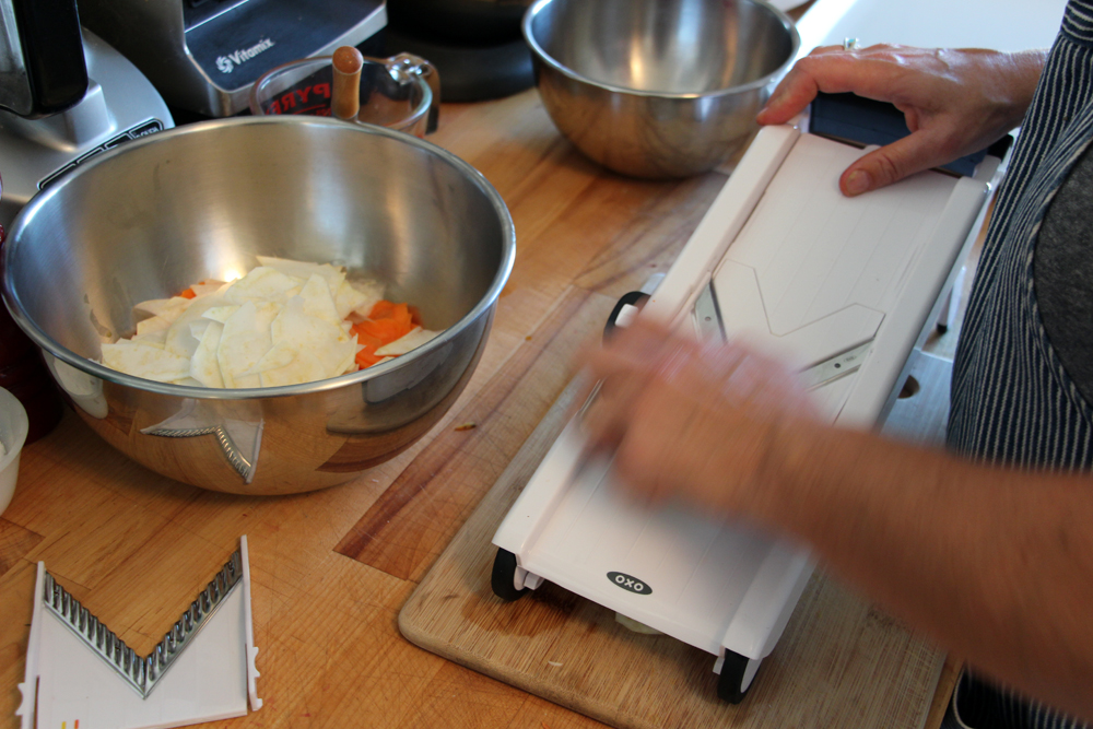 Using a mandoline, thinly slice the root vegetables. Photo: Wendy Goodfriend