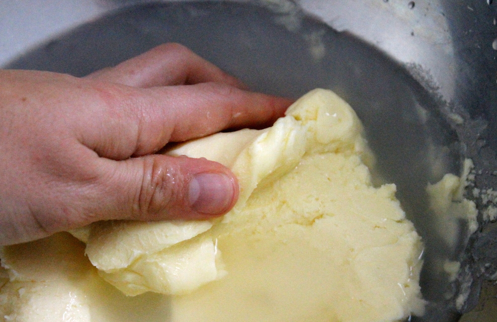 Knead the butter in cold water to expel even more buttermilk. Photo: Kate Williams