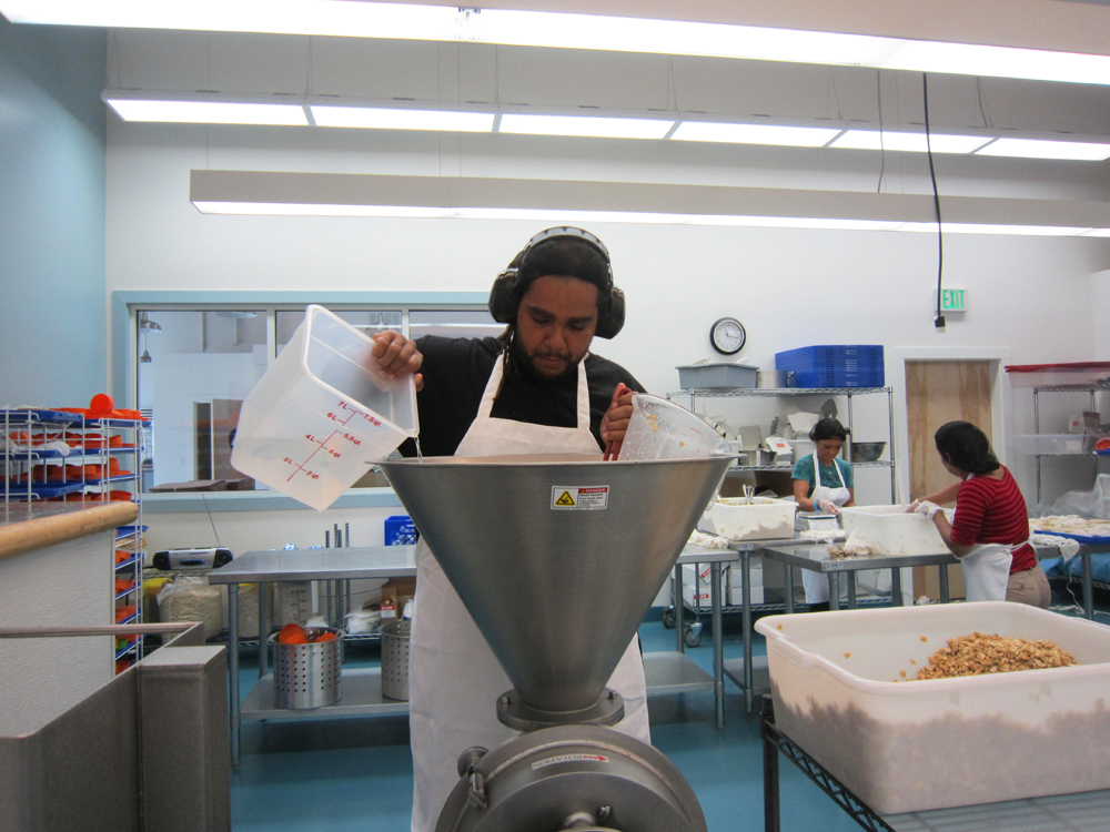 An employee makes the cashew slurry. Photo: Alix Wall