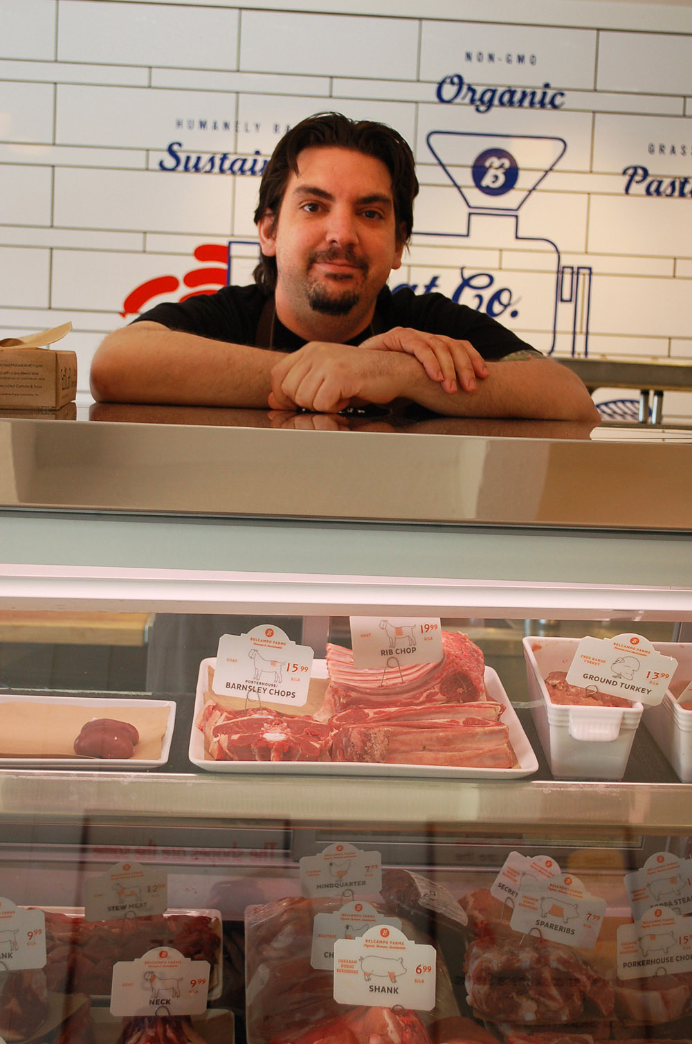 Butcher Matthew Prentice at Belcampo Meat in Palo Alto offers patrons free-range, organic meat from animals that the company raises, slaughters and sells direct. Photo: Susan Hathaway