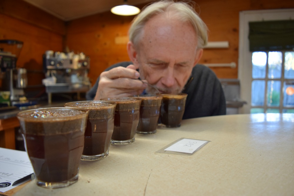 Kenneth Davids smells his coffee as part of the tasting. Photo: Shelby Pope