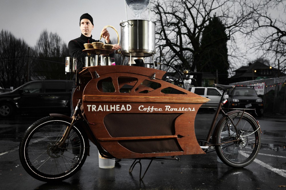 Charlie Wicker of Trailhead Coffee Roasters makes all of his deliveries within the 6-mile radius of urban Portland, Ore., on one of his custom-built cargo bikes. He can also pull over to brew and serve coffee. Photo: John Lee/Courtesy of Trailhead Coffee Roasters