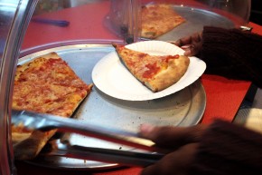 Slices of pizza on the counter of Rosa's Fresh Pizza where customers are encouraged to pay it forward. Photo: Elizabeth Fiedler/WHYY