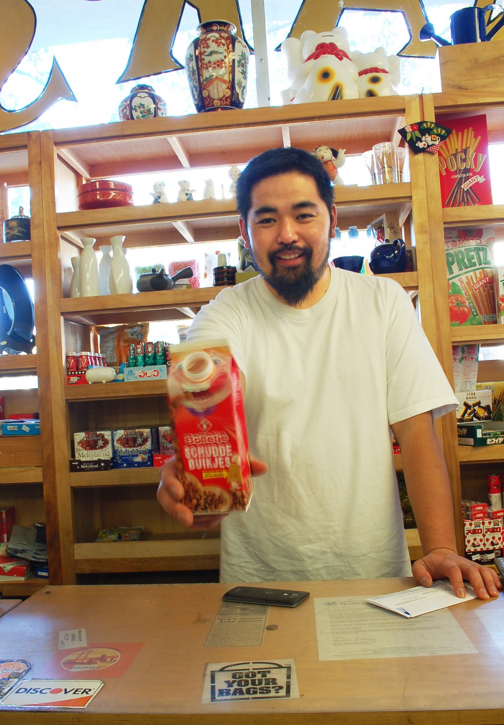 Proprietor Ken Kurose of Nak's Oriental Market freely and frequently offers samples, deals and smiles to customers of his tiny Menlo Park store. Photo: Susan Hathaway