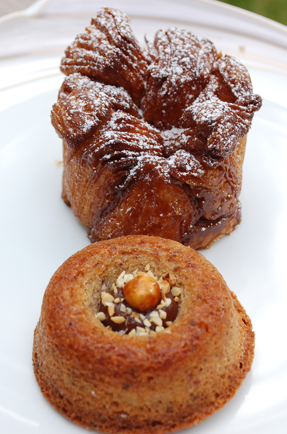 Recent creations include a luscious hazelnut tea cake (front) with a dab of ganache and irresistible "monkey bread." Photo: Susan Hathaway