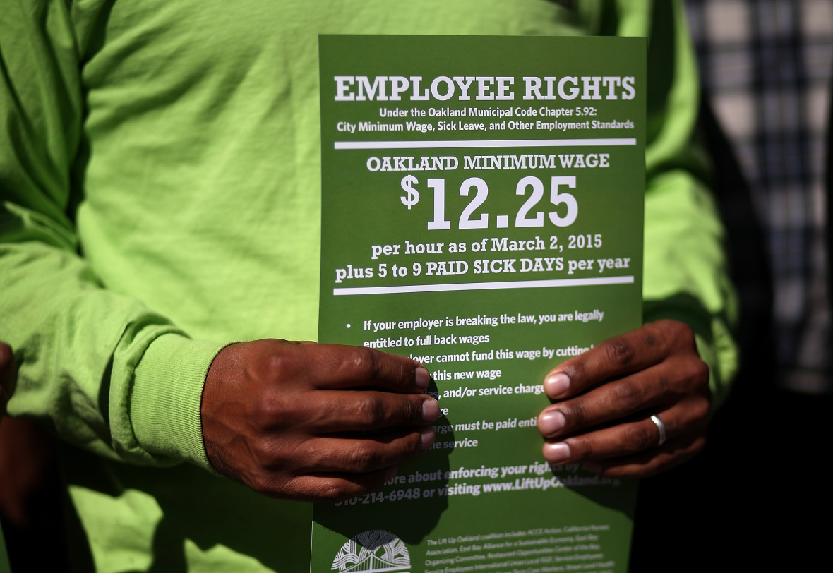 A supporter of Oakland's new $12.25 minimum wage. Photo: Justin Sullivan/Getty Images