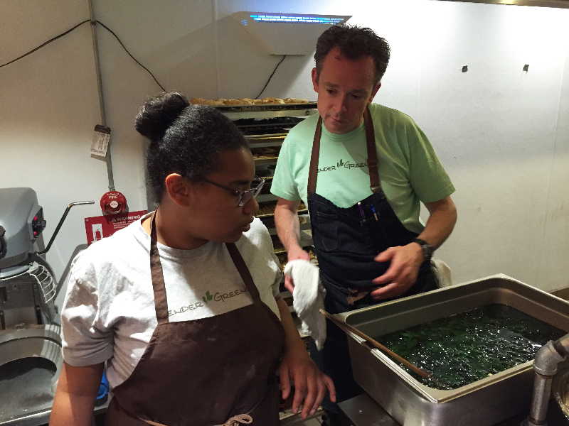 Tender Greens executive chef Sean Eastwood supervises Caridad Johnson blanch spinach. Photo: Alix Wall