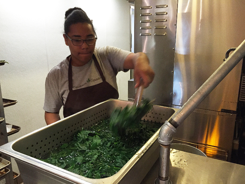 Cari Johnson blanches spinach and then puts it in an ice bath to cool before making ravioli. Photo: Alix Wall