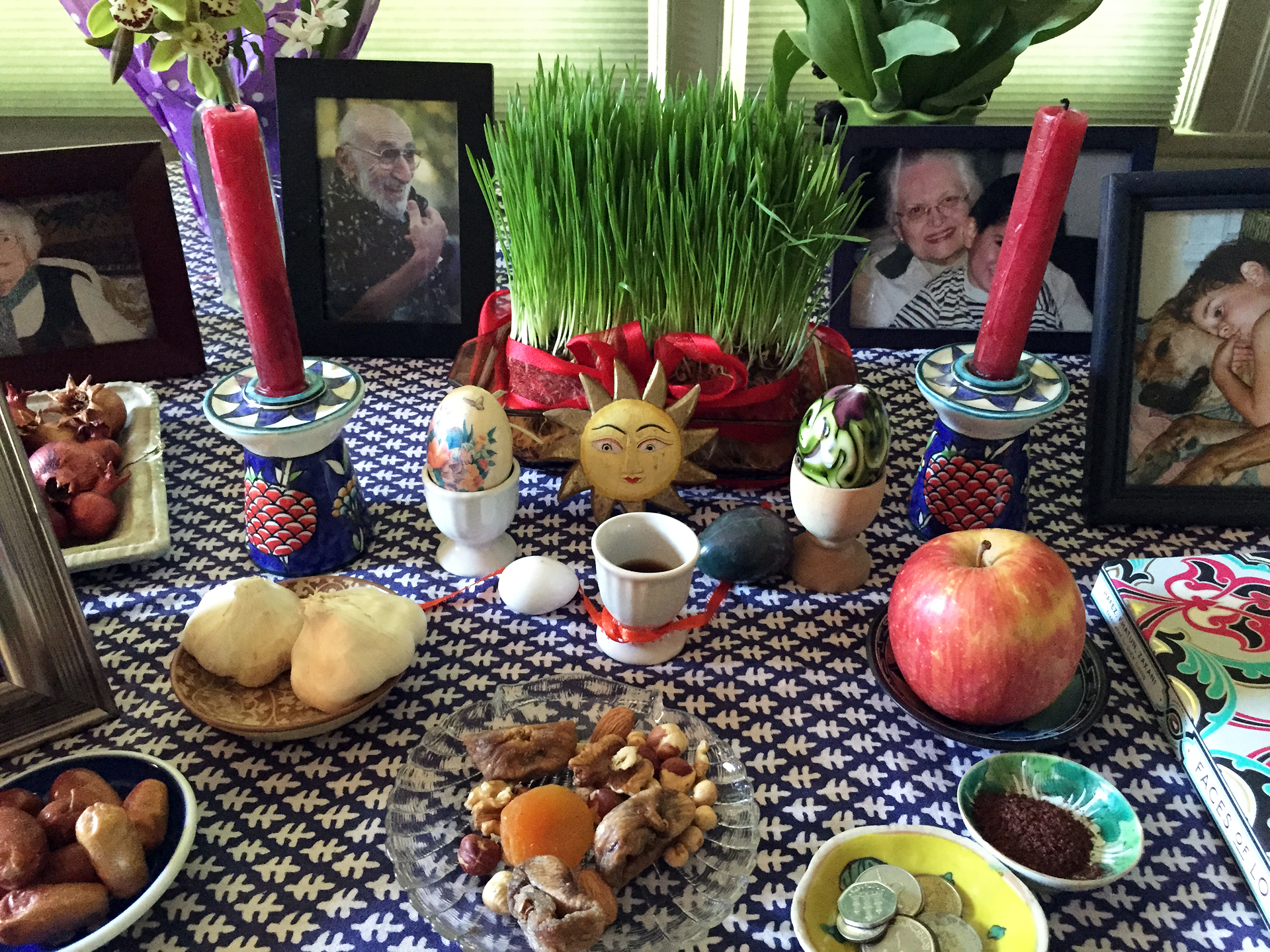 The Persian New Year begins on the first day of Spring. To celebrate, families create a 'haftsin,' a table decorated elaborately with different foods like fresh apples and sprouted herbs.
