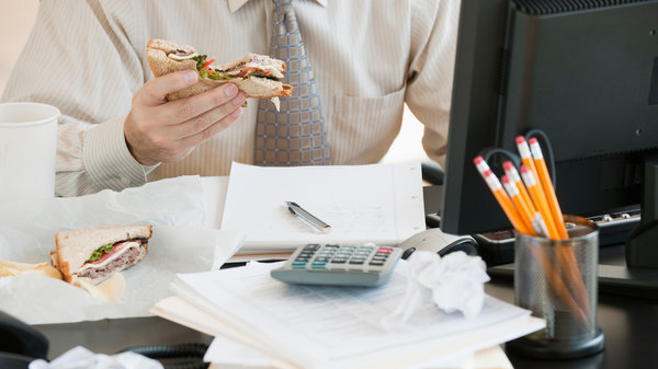 Eating at your desk day after day? Research suggests "staying inside, in the same location, is really detrimental to creative thinking," says management professor Kimberly Elsbach. Photo: 145/Tom Grill/Ocean/Corbis 