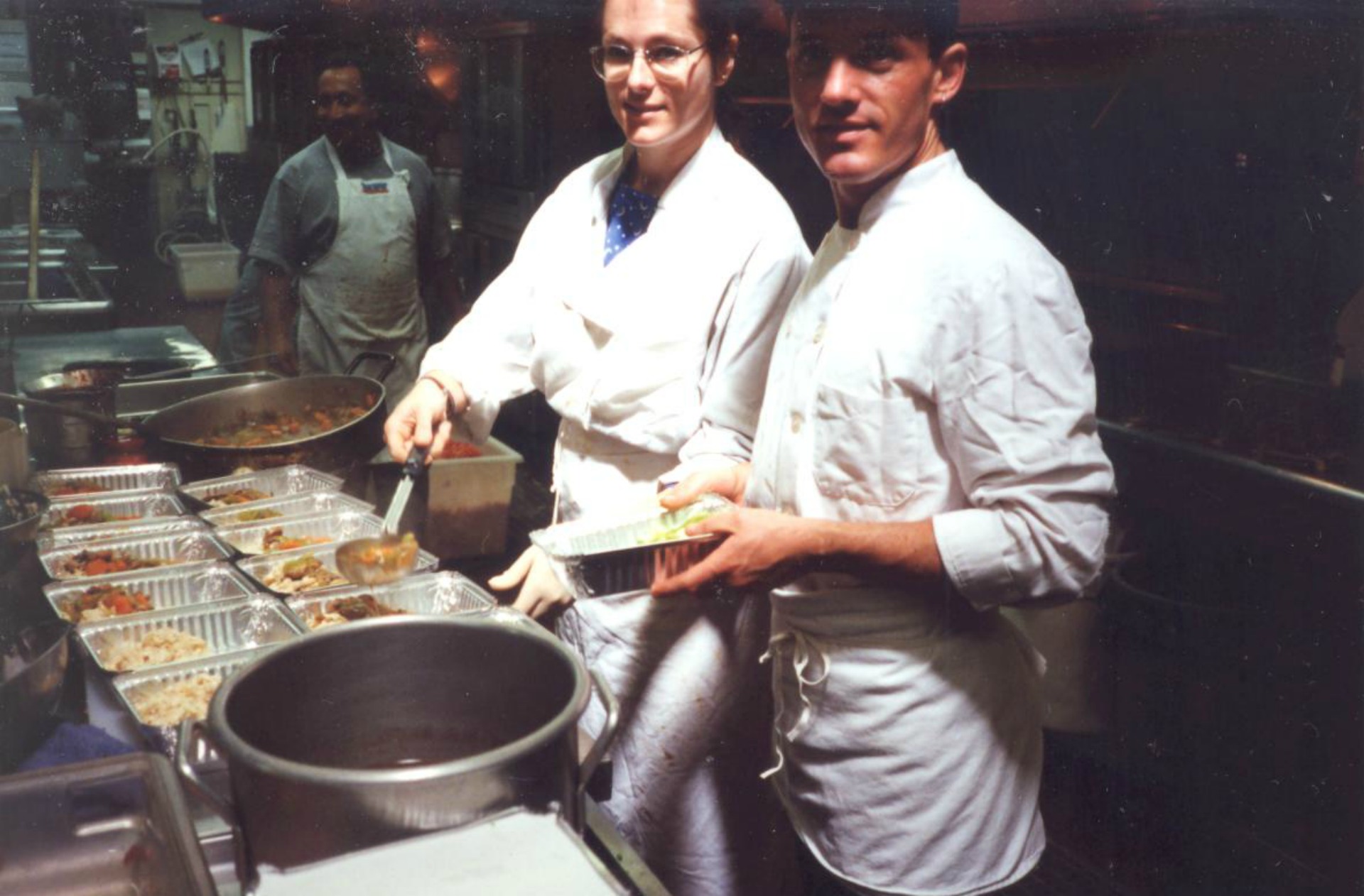 Volunteers prep meals in the organization's early days.