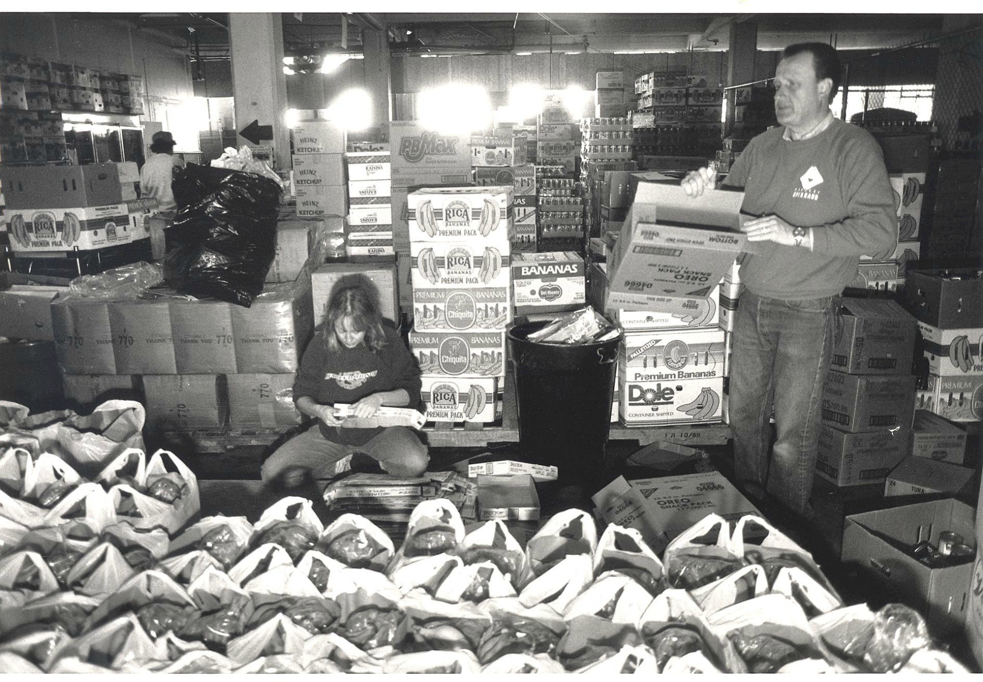 Volunteers bag groceries in the early days.