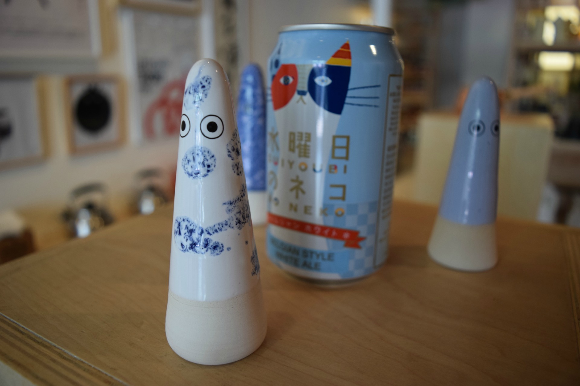 Ceramic ghosts protect the Wednesday Cat beer.