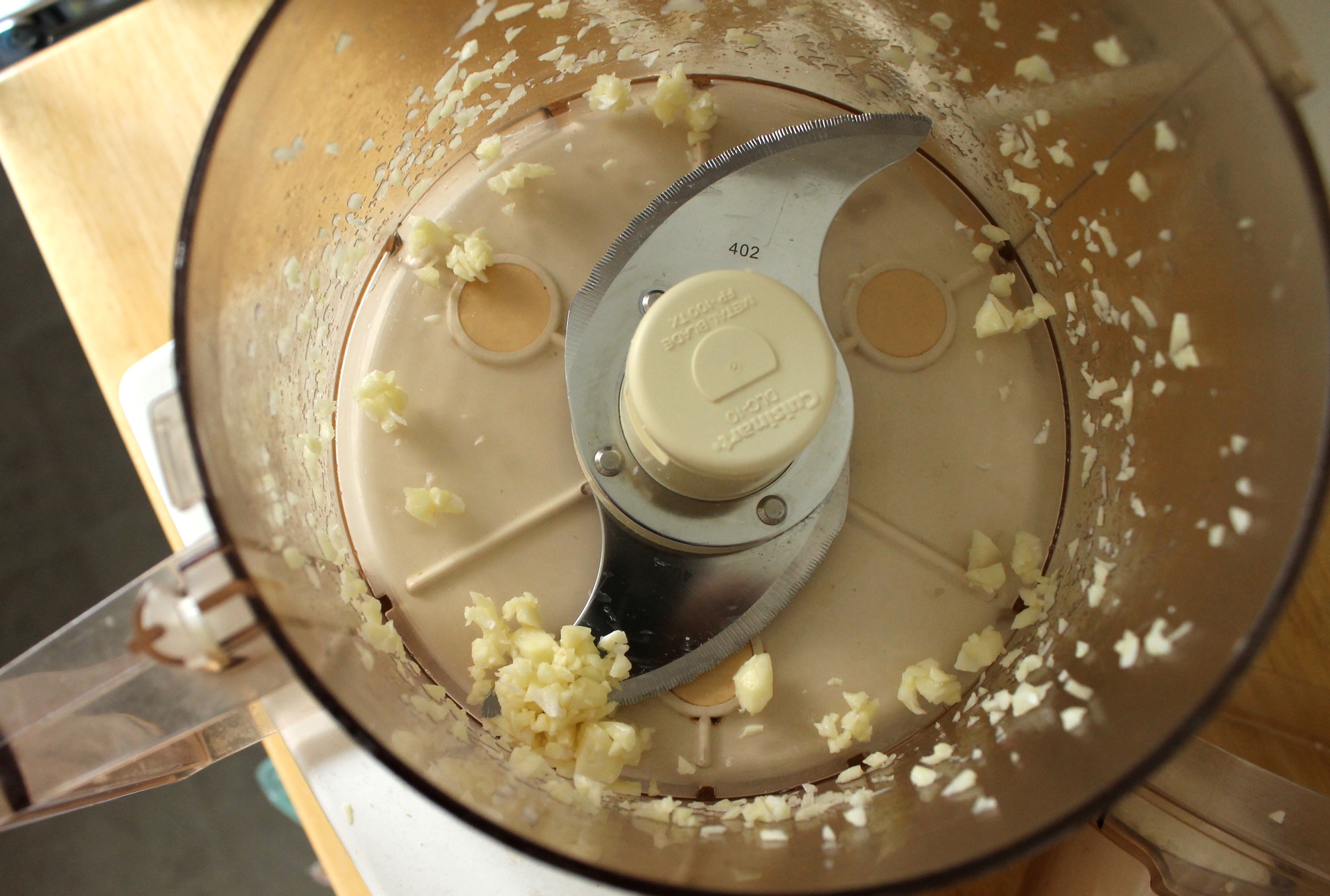 Keep things simple by mincing the garlic in the food processor.