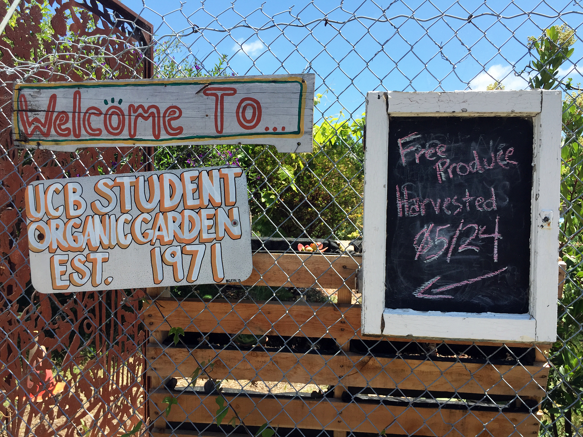 A sign outside the garden tells when there’s produce being given away. 
