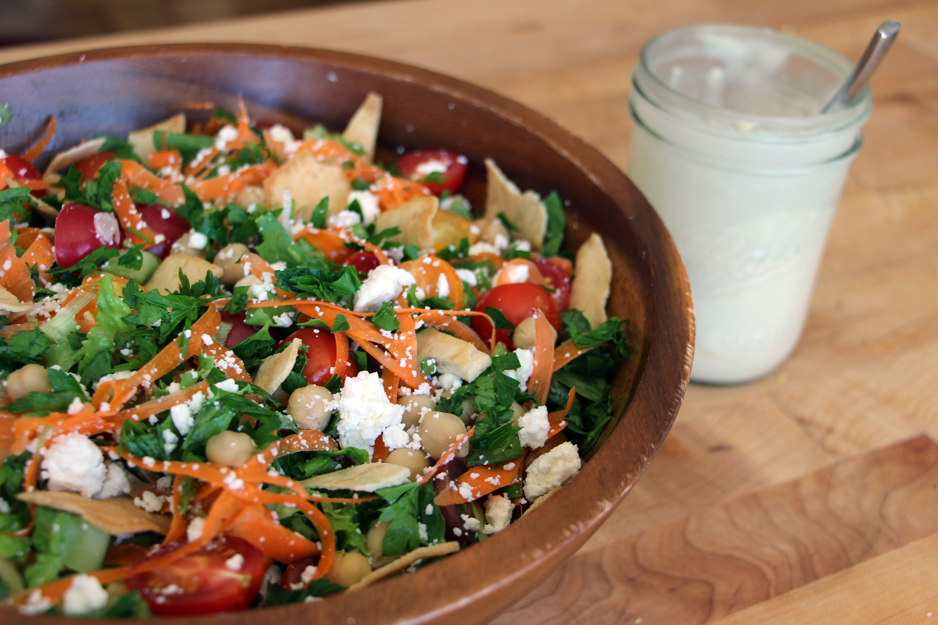 Add pita chips to Mediterranean Salad and serve with extra Tahini dressing on the side..